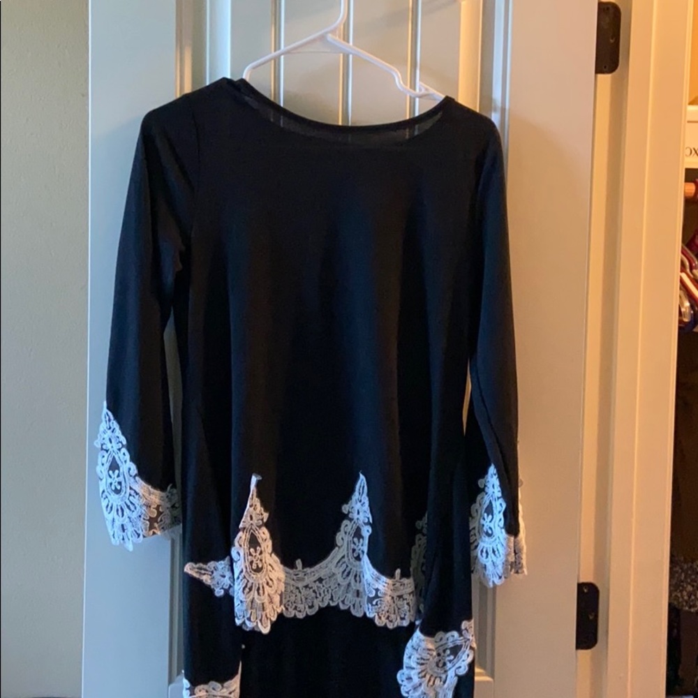 Black Long sleeve shirt with detail.